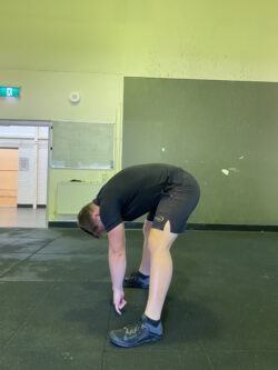 Justin performing a quad stretch